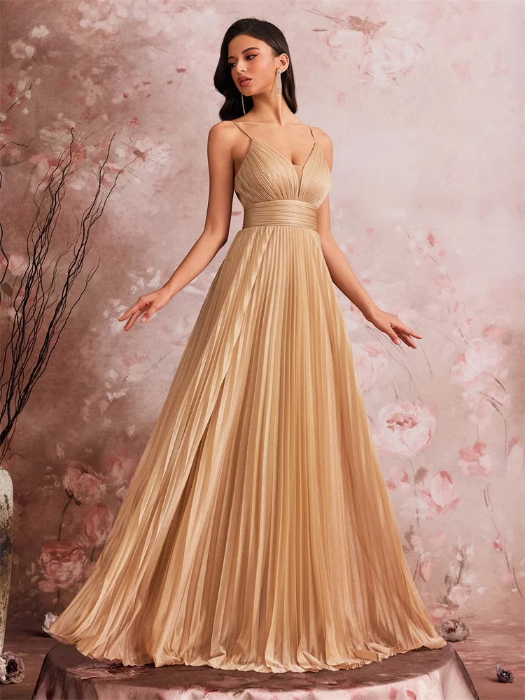 Dream Designs Boutique gold chiffon A-line evening gown with deep V-neck and pleated skirt