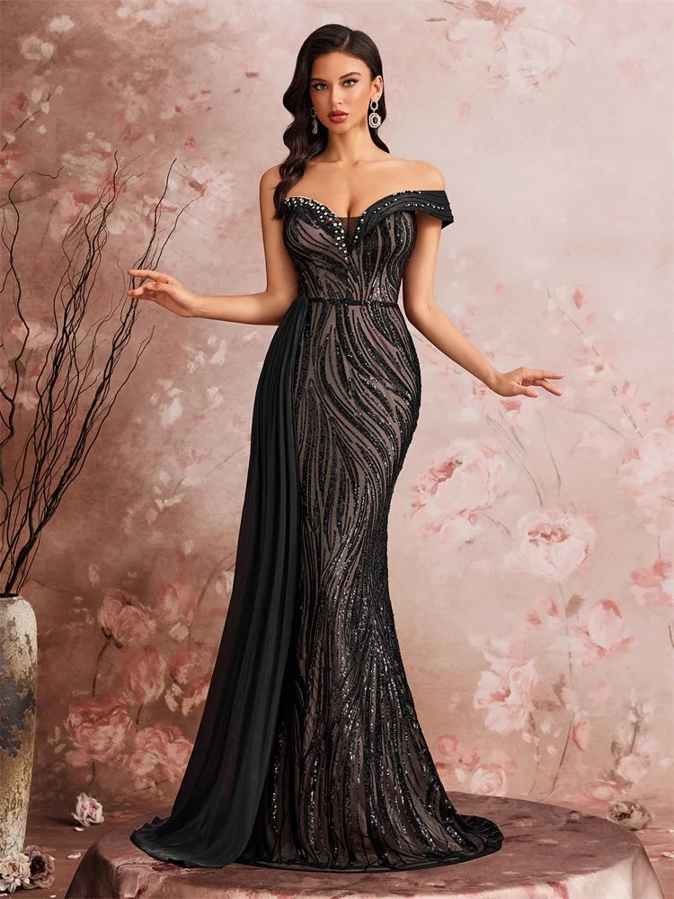 Dream Designs Boutique off-the-shoulder sequined mermaid evening gown in black.