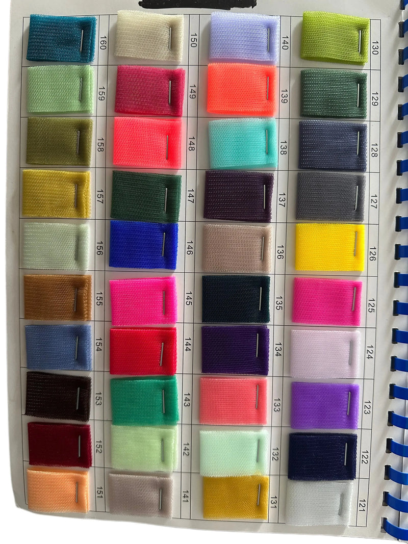A colorful grid of various fabric swatch samples in different shades and textures.