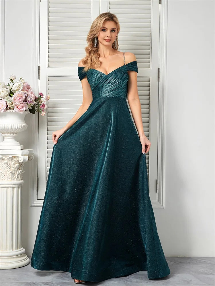 Sparkly beaded teal A-line evening gown with an open back by Dream Designs Boutique