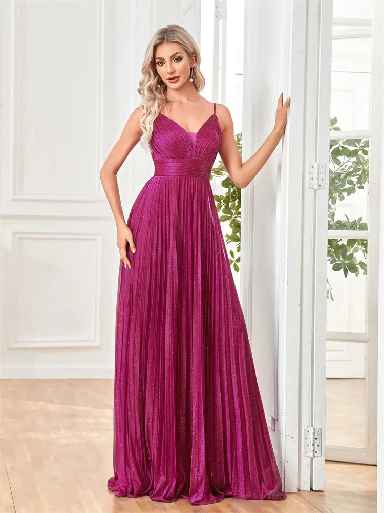 Woman wearing a Dream Designs Boutique deep V-neck magenta chiffon A-line evening gown.