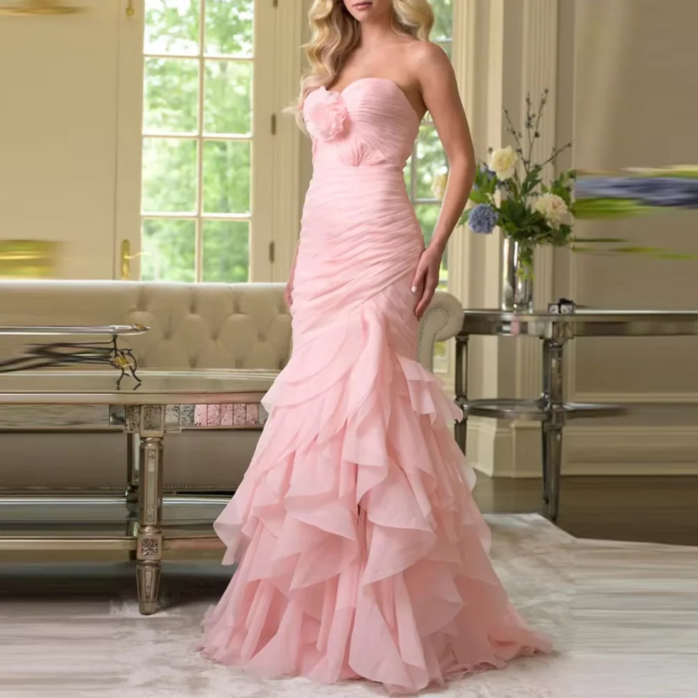 Dream Designs Boutique pink strapless organza mermaid gown with tiered ruffles and floral detail