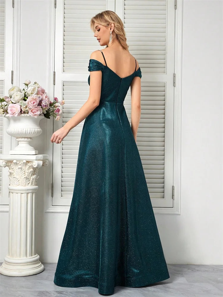 Dream Designs Boutique sparkly beaded teal A-line evening gown with an open back.