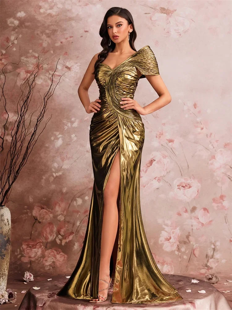 Woman in a metallic gold one-shoulder mermaid gown by AliExpress with sculptural pleating.