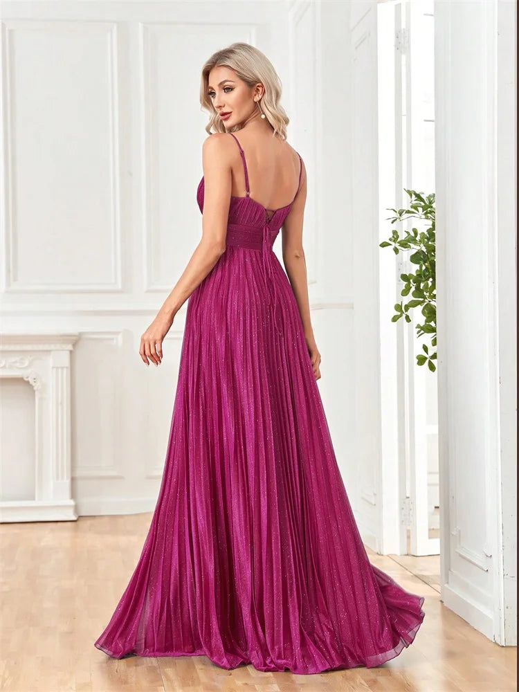 Woman in a magenta deep V-neck chiffon A-line evening gown by Dream Designs Boutique