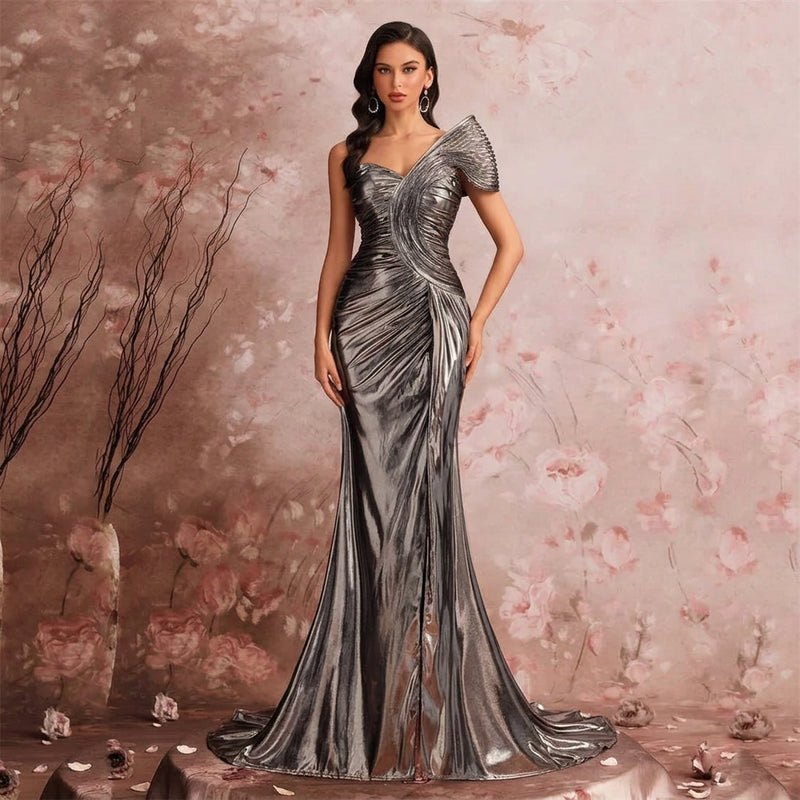 Woman wearing an AliExpress metallic satin one-shoulder mermaid gown with sculptural pleating.