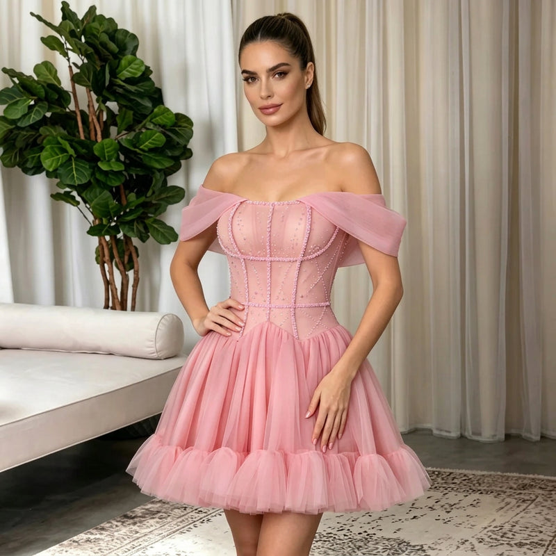 Woman wearing an off-the-shoulder short pink formal mini dress by AliExpress