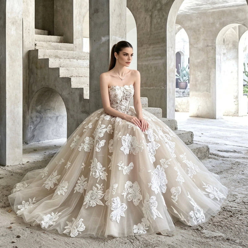 Woman wearing a strapless floral applique A-line bridal gown by AliExpress in a concrete archway.