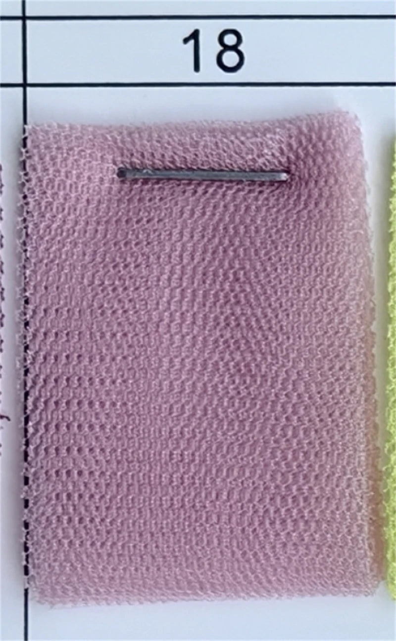 Close-up of a dusty rose pink fabric swatch sample from AliExpress.