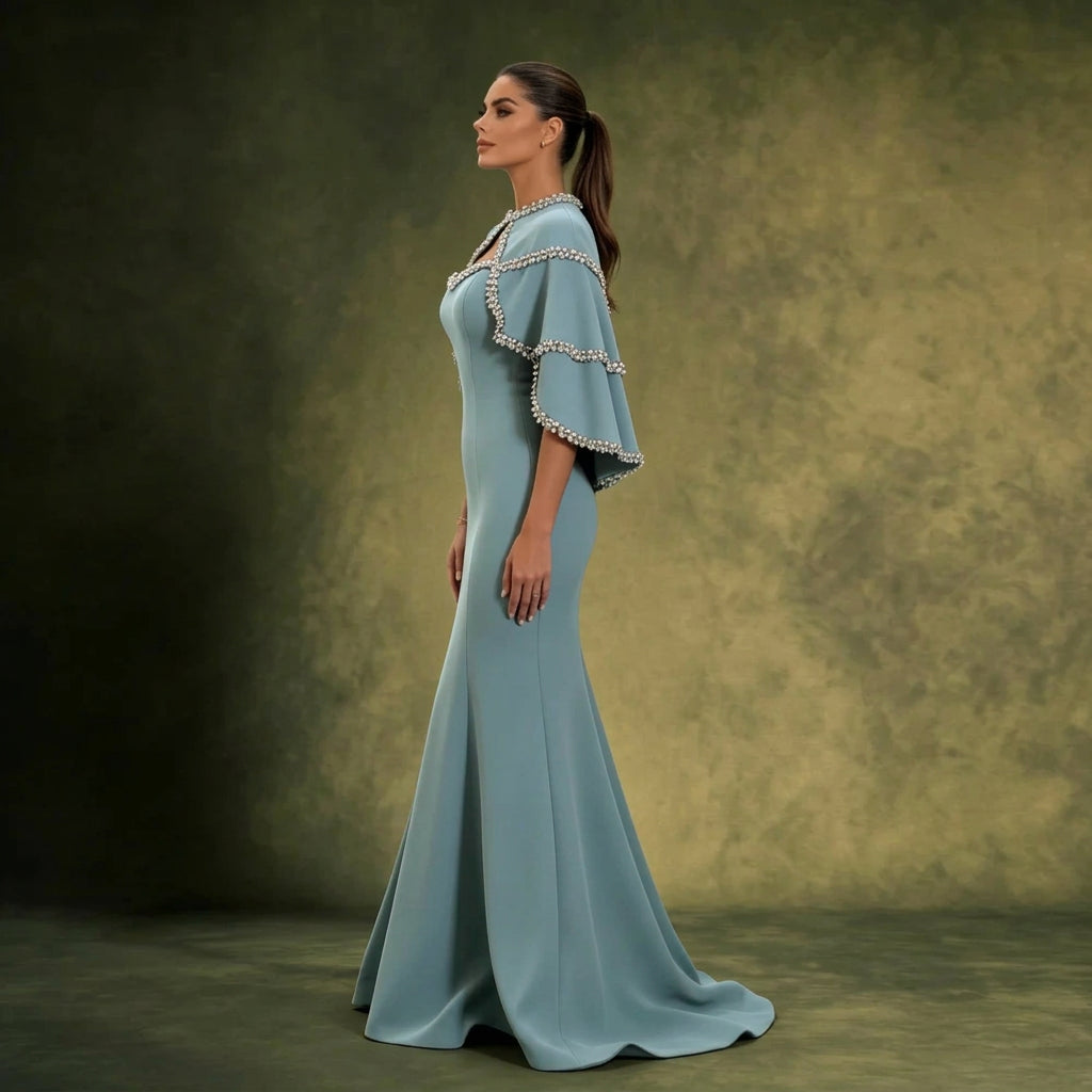 Dusty Blue Mermaid Gown with Crystal-Trimmed Cape