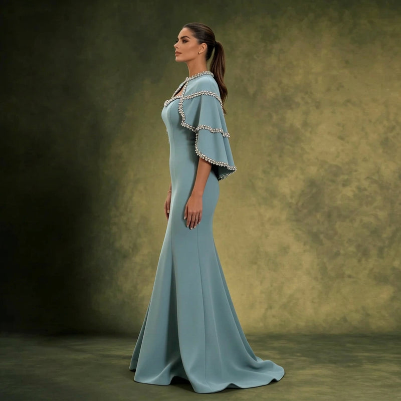 Dusty Blue Mermaid Gown with Crystal-Trimmed Cape