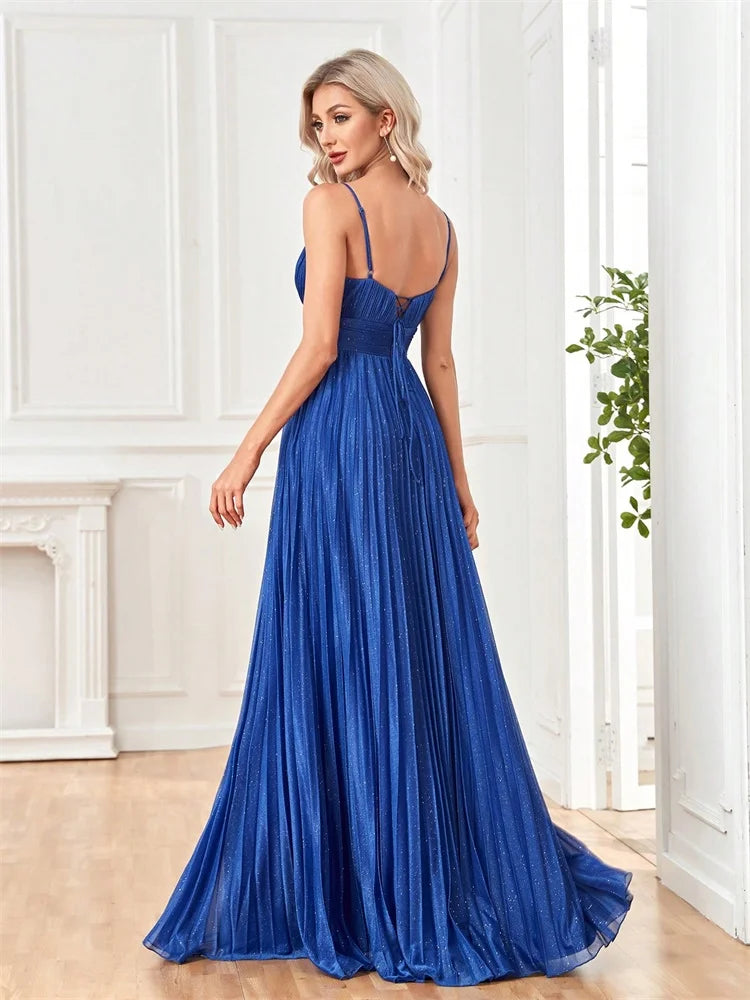Back view of a Dream Designs Boutique royal blue chiffon A-line evening gown with deep V-neck.