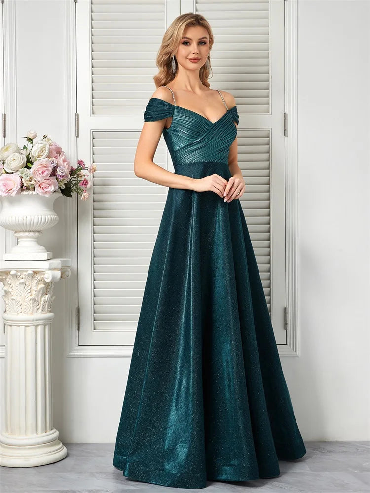 Dream Designs Boutique sparkly beaded teal A-line evening gown with an open back.