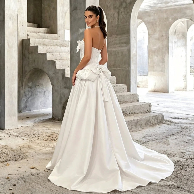 Woman wearing a strapless corset style wedding gown with a train by AliExpress