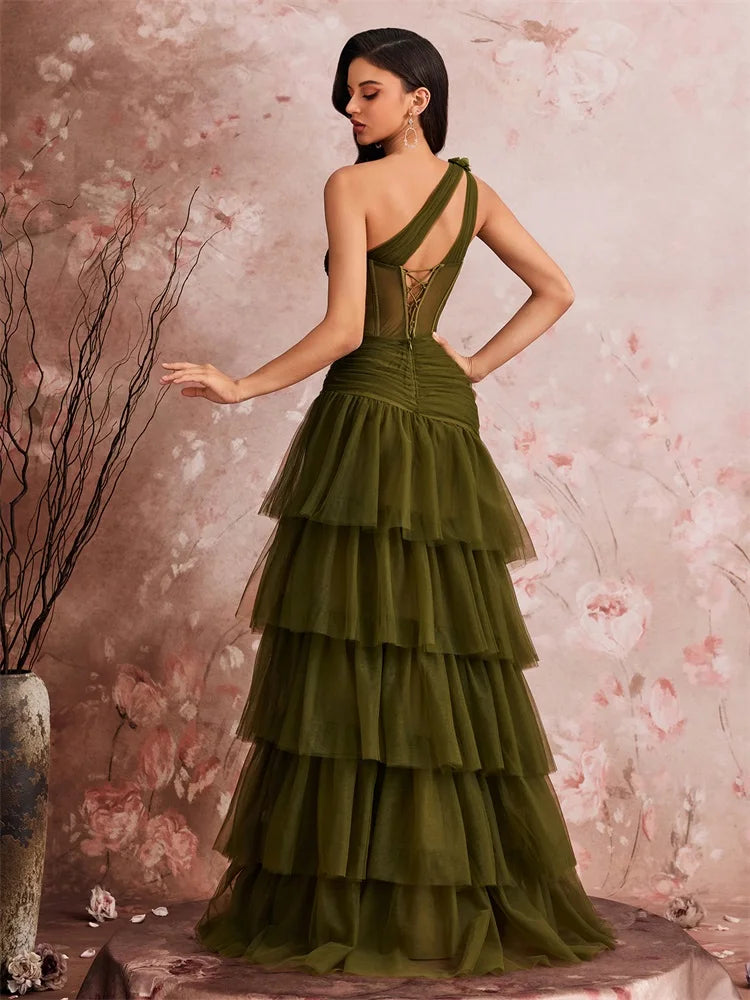 Back view of a luxury asymmetric tulle evening gown in olive green by Dream Designs Boutique