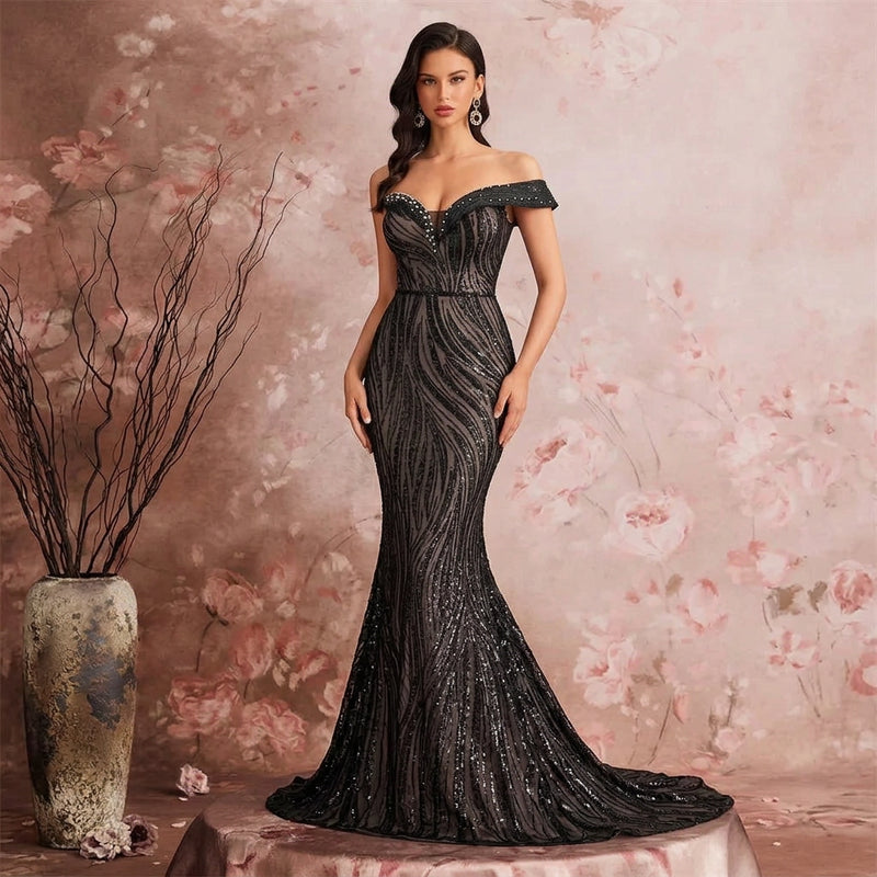 Elegant off-the-shoulder sequined mermaid evening gown in black by Dream Designs Boutique