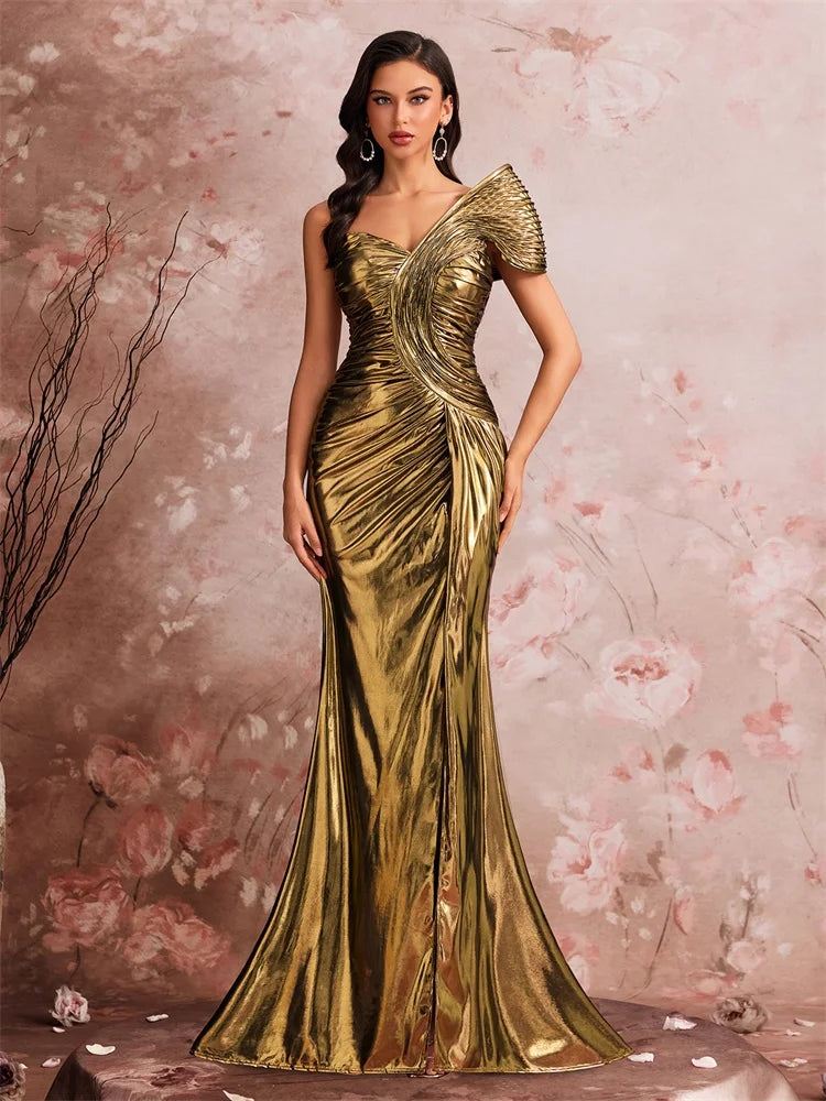 Woman wearing a metallic gold one-shoulder mermaid gown by AliExpress with sculptural pleating.