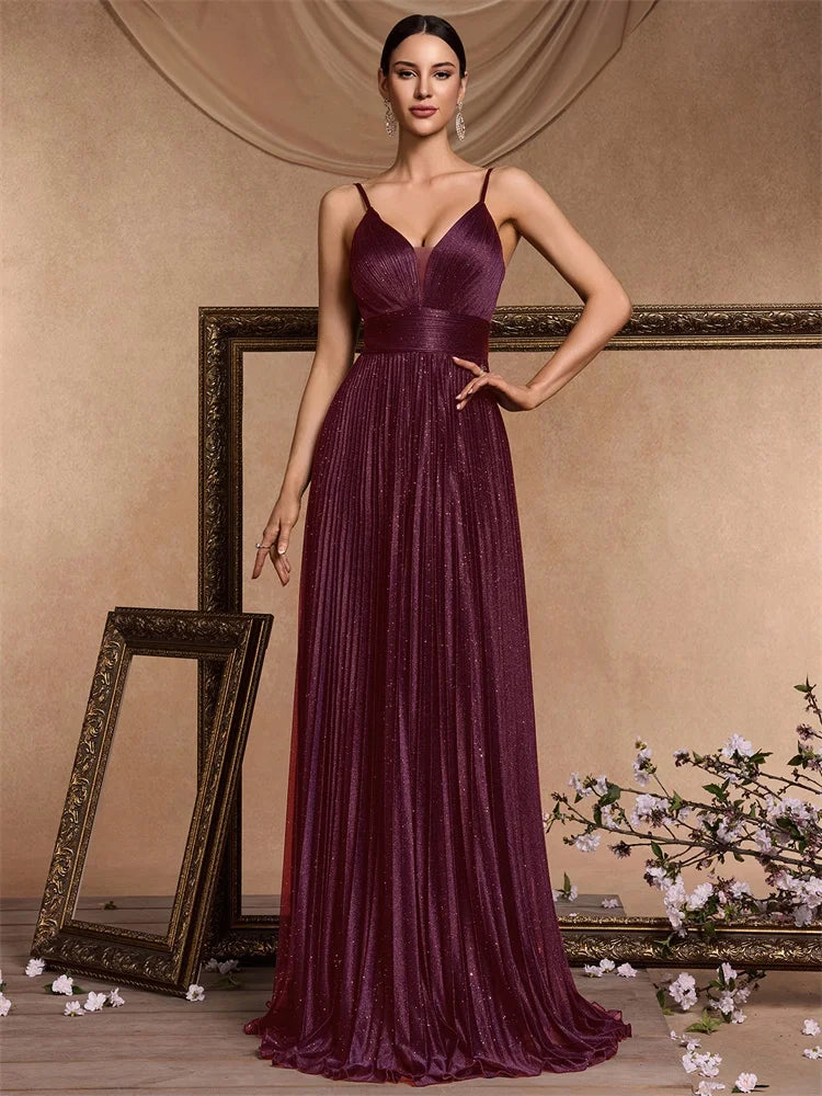 Dream Designs Boutique deep V-neck chiffon A-line evening gown in plum purple.