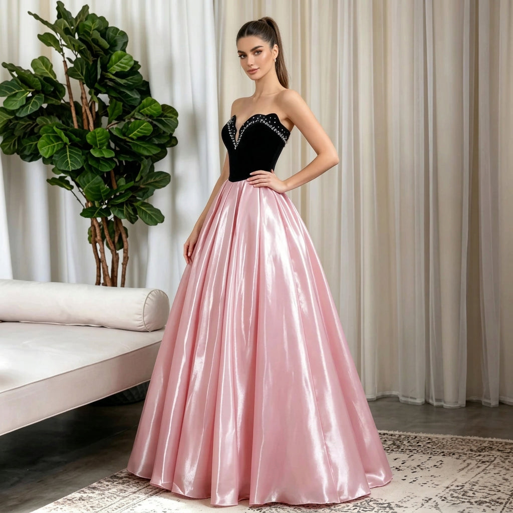 Woman in a strapless black velvet bodice and pink satin A-line evening gown