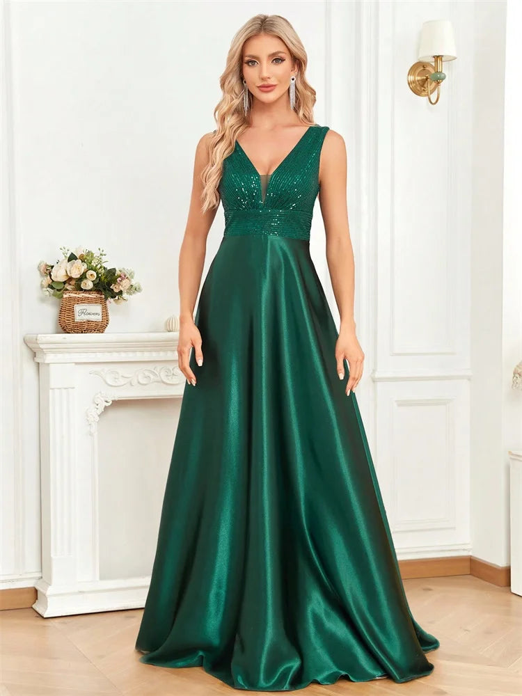 Dream Designs Boutique emerald green sequined V-neck A-line evening gown with pockets