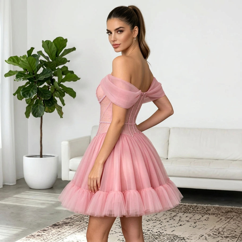 Woman wearing an AliExpress off the shoulder pink short formal mini tulle dress