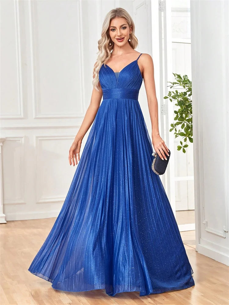 Woman in a royal blue deep V-neck chiffon A-line evening gown by Dream Designs Boutique