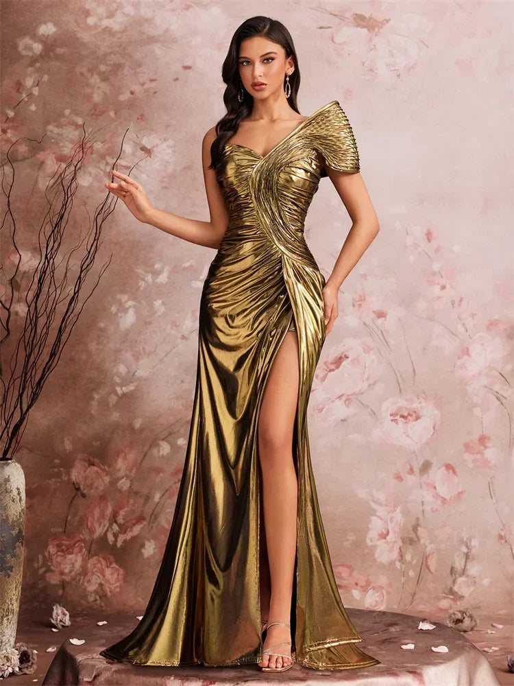 Woman wearing a metallic gold one-shoulder mermaid gown by AliExpress with sculptural pleating.