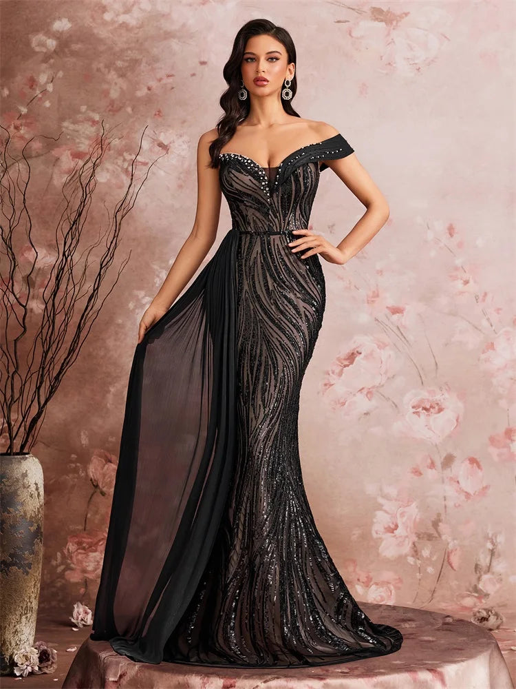 Dream Designs Boutique off-the-shoulder sequined mermaid evening gown in black.