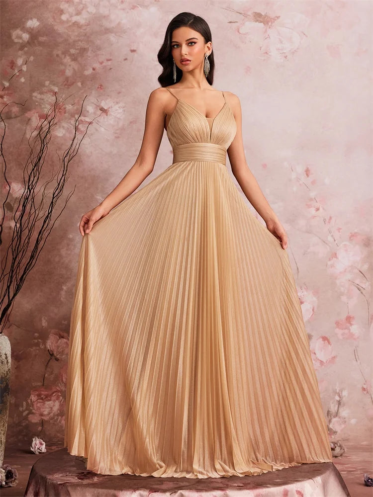 Woman wearing an elegant Dream Designs Boutique deep V-neck chiffon A-line evening gown.