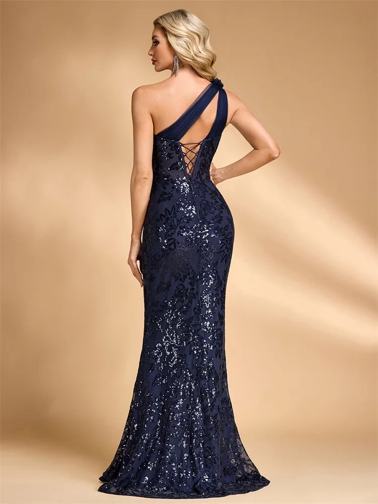 Back view of Dream Designs Boutique navy blue asymmetric sequined mermaid evening gown.